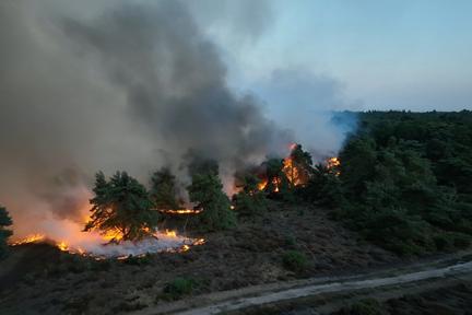 Wildfires Rage Across Europe, Threaten UK Nuclear Plant
