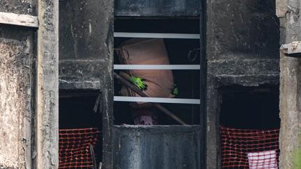 Hong Kong Fire Victims Return