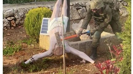 Israeli Soldier Smashes Jesus Statue