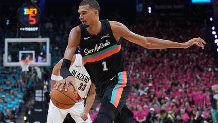 Wembanyama shines in playoff debut