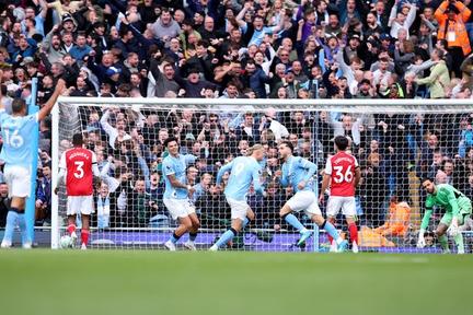 Man City edge Arsenal in thriller
