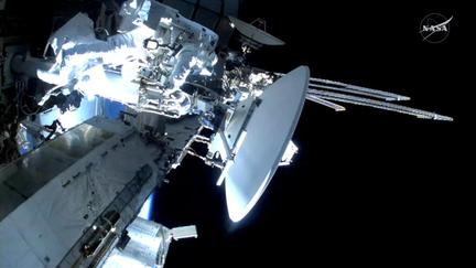 Astronauts spacewalk to replace ISS antenna