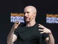 Coinbase to cut 14% of staff